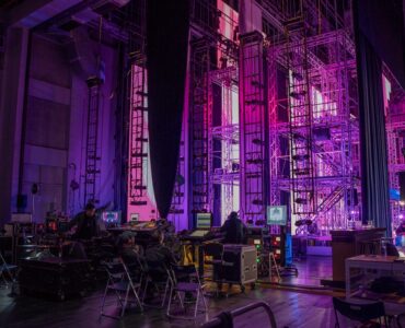 Event AV Production Stage — November Wong Professional audiovisual stage setup for a live event